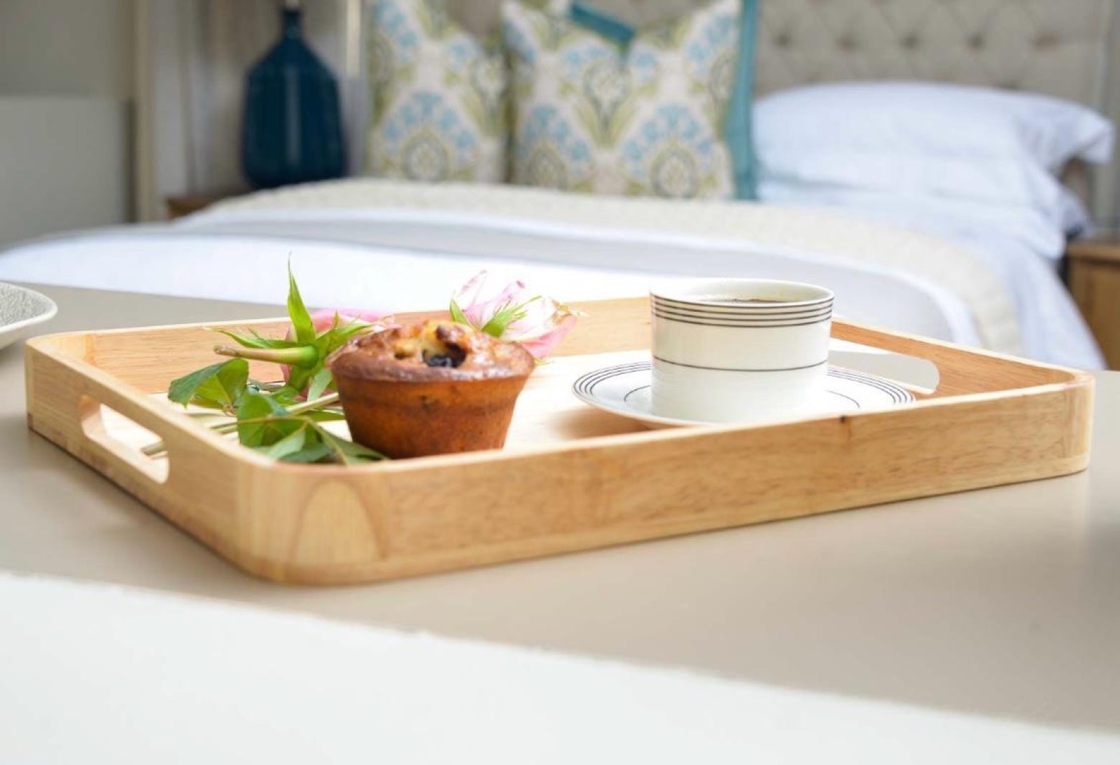 A breakfast tray laid on the bed